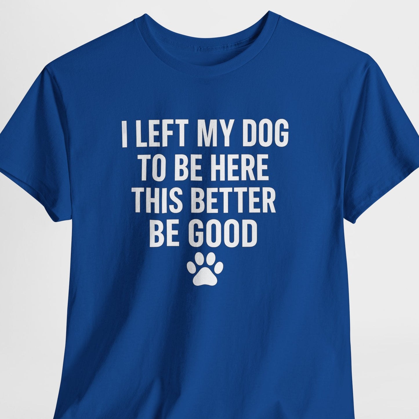Blue t-shirt with white text and paw print on a light gray background