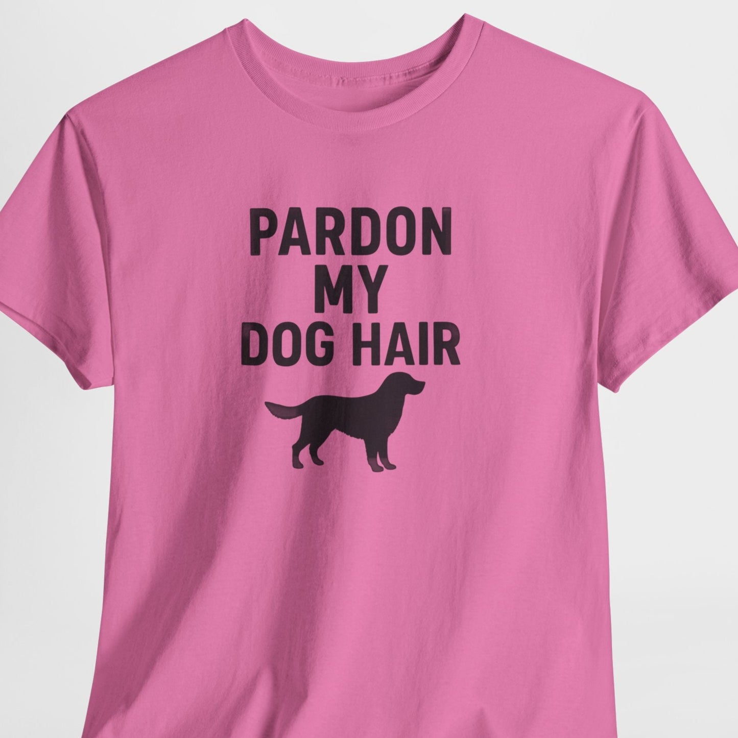 Pink t-shirt with 'Pardon My Dog Hair' text and dog silhouette on a white background