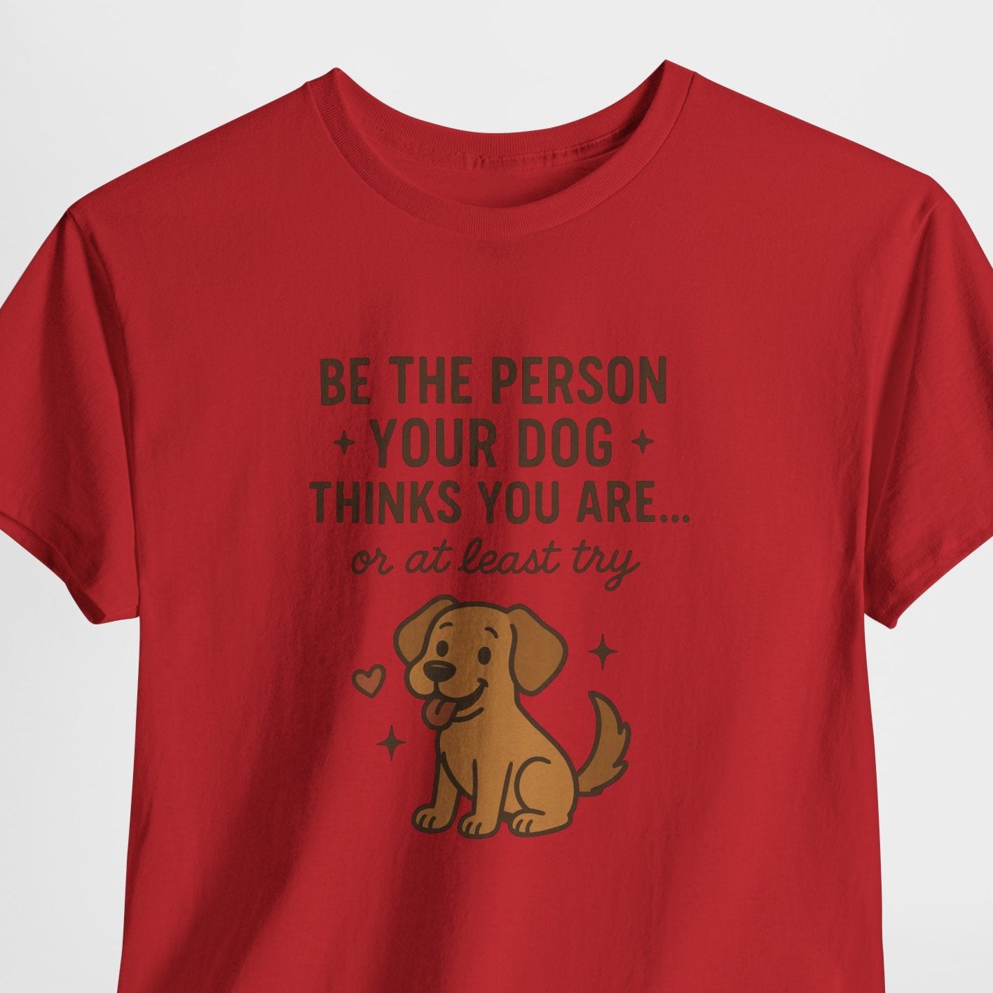 Red t-shirt with a dog graphic and text on a white background