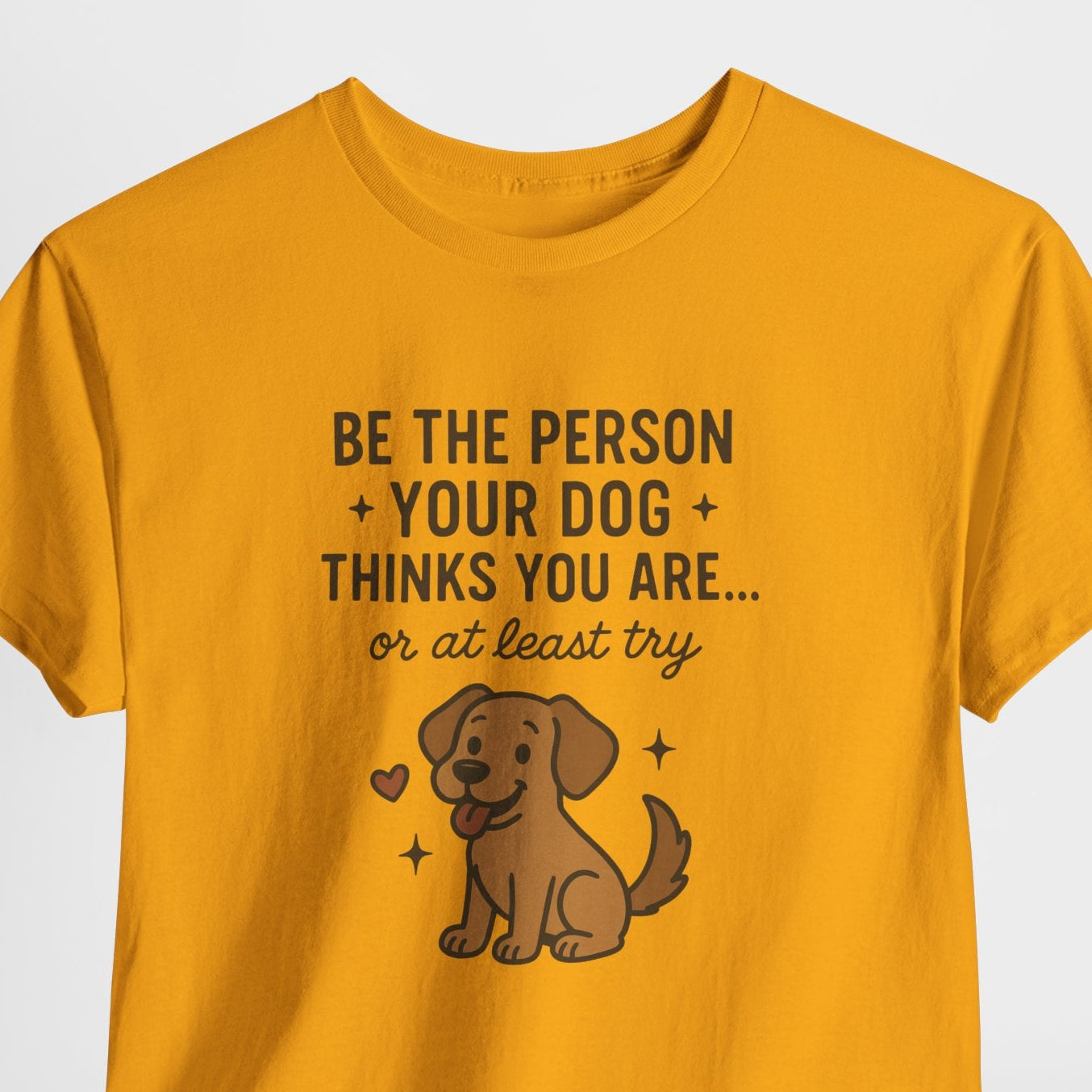 Yellow t-shirt with a dog graphic and text on a white background