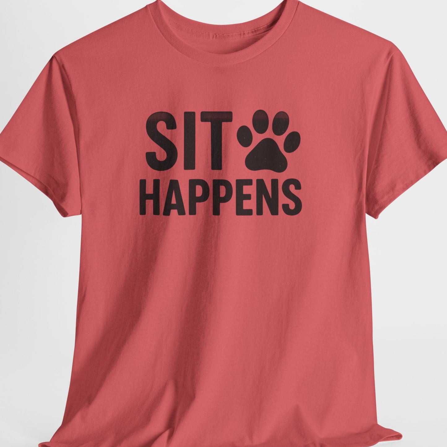 Red t-shirt with 'SIT HAPPENS' text and paw print on a light gray background