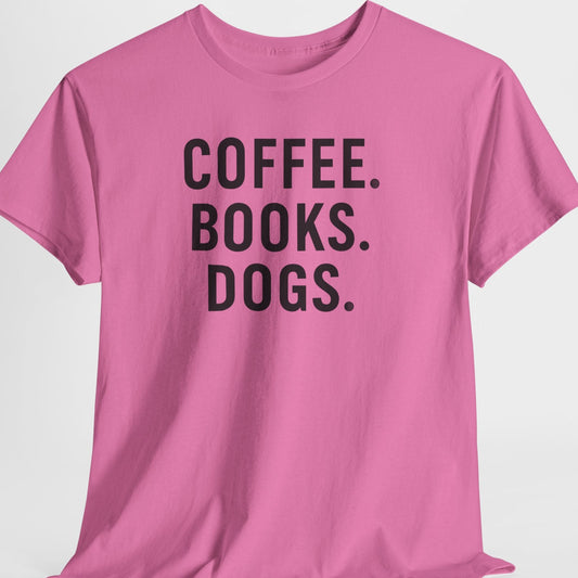 Pink t-shirt with 'COFFEE. BOOKS. DOGS.' text on a light gray background