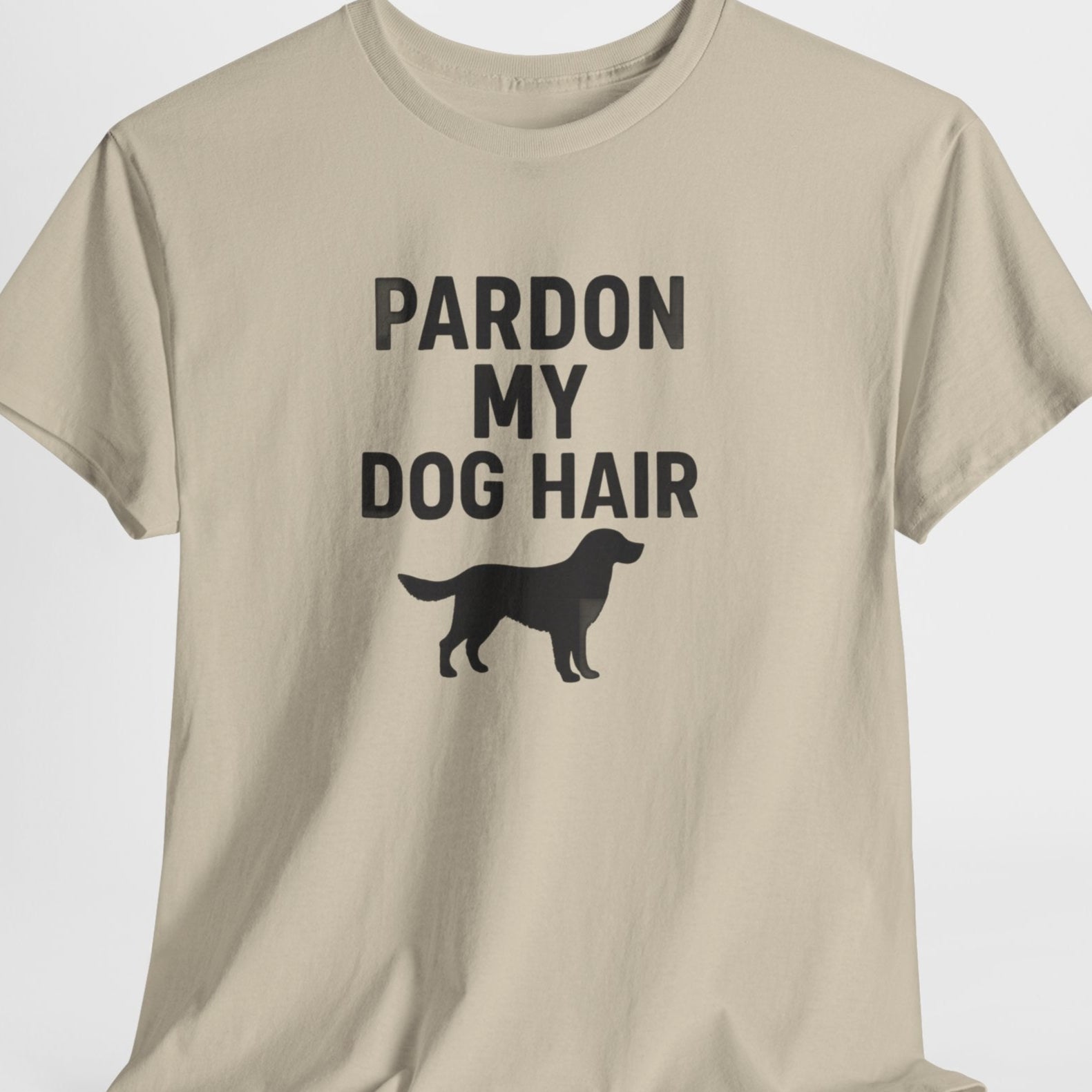 Beige t-shirt with 'Pardon My Dog Hair' text and dog silhouette on a white background