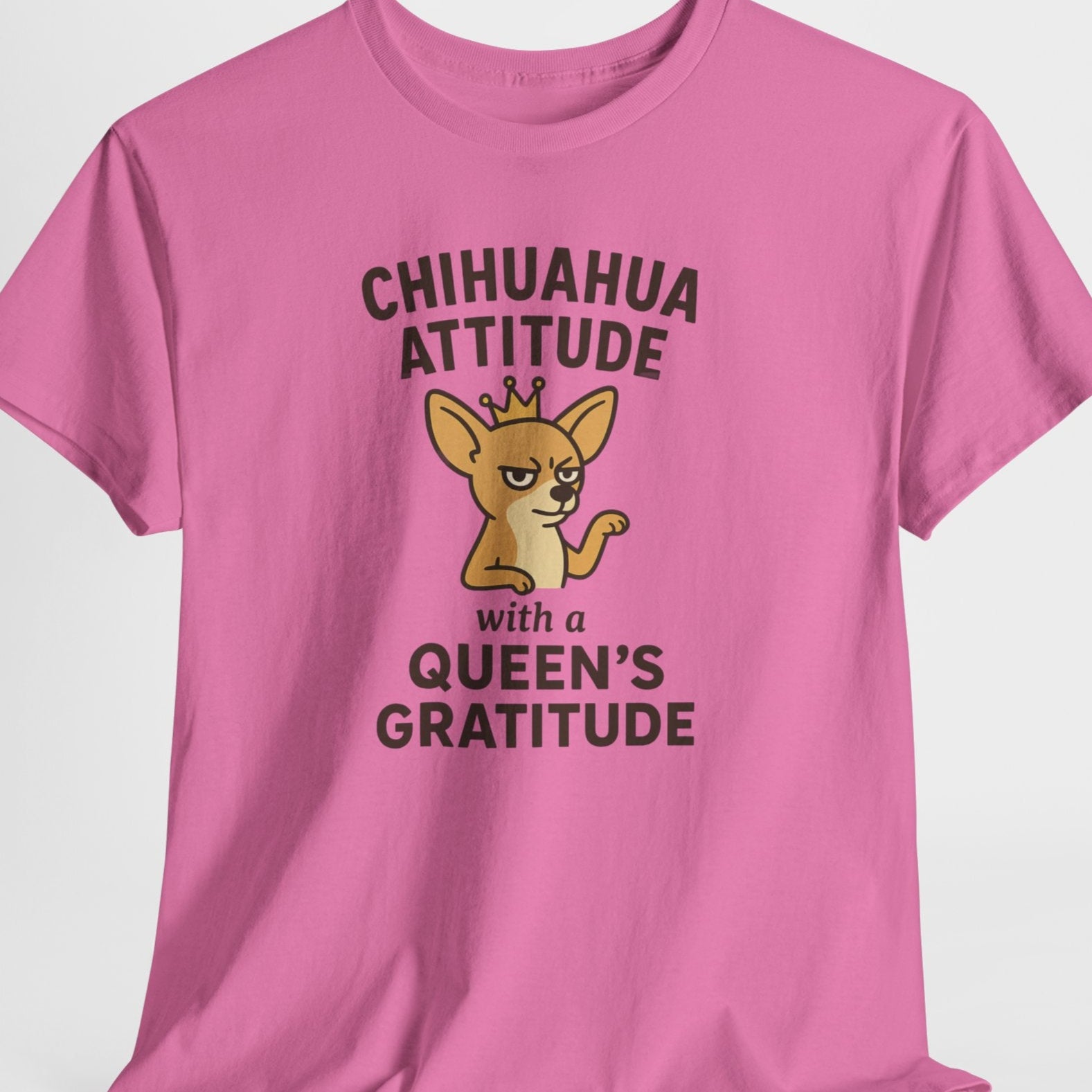 Pink t-shirt with a chihuahua graphic and text on a white background
