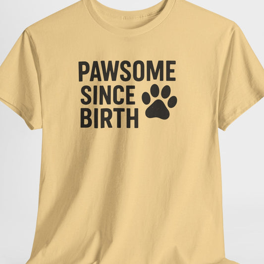 Beige t-shirt with 'PAWSOME SINCE BIRTH' text and paw print on a light gray background