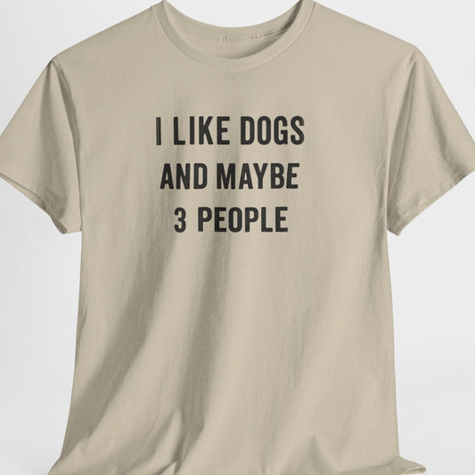 Beige t-shirt with text 'I LIKE DOGS AND MAYBE 3 PEOPLE' on a white background