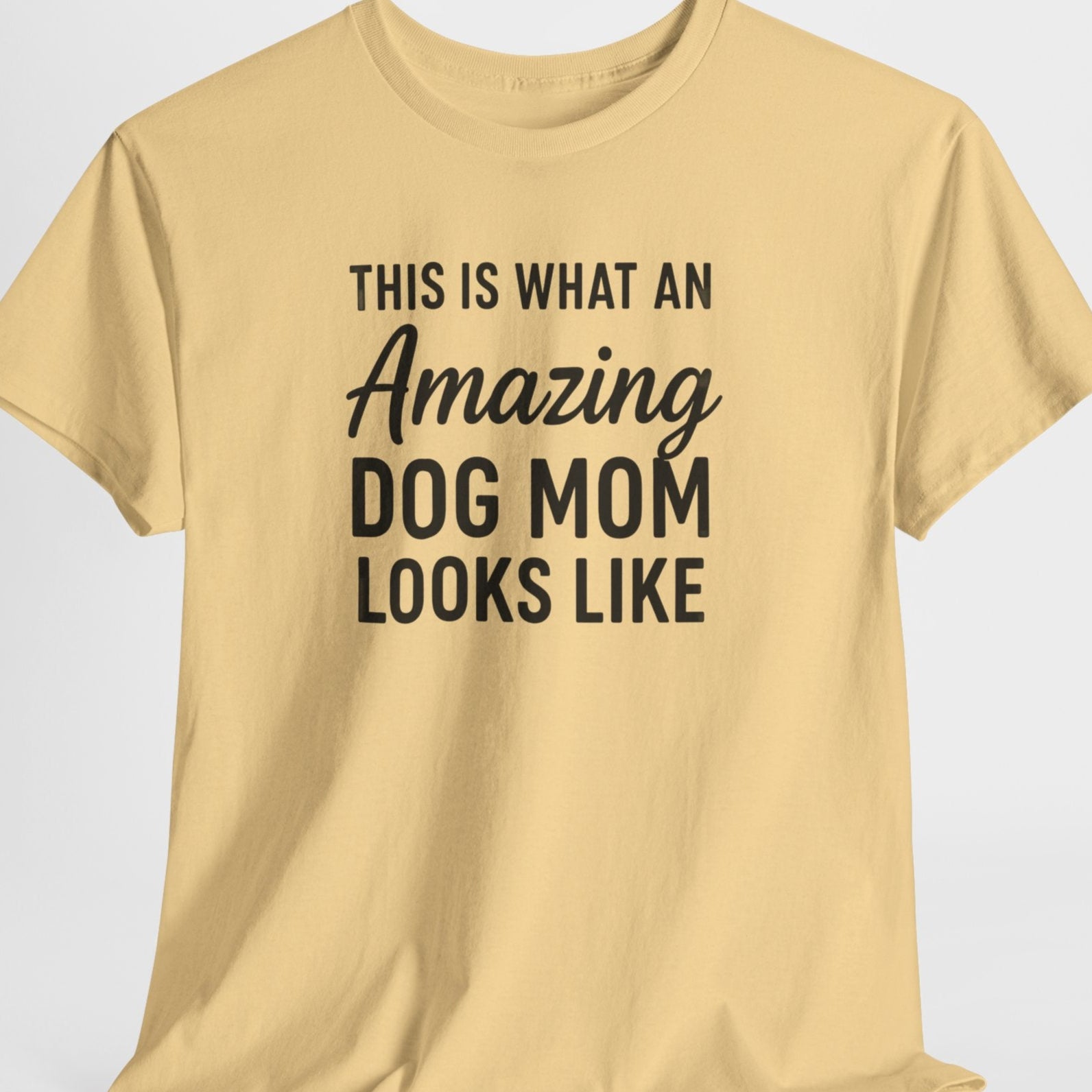 Beige t-shirt with black text on a light gray background