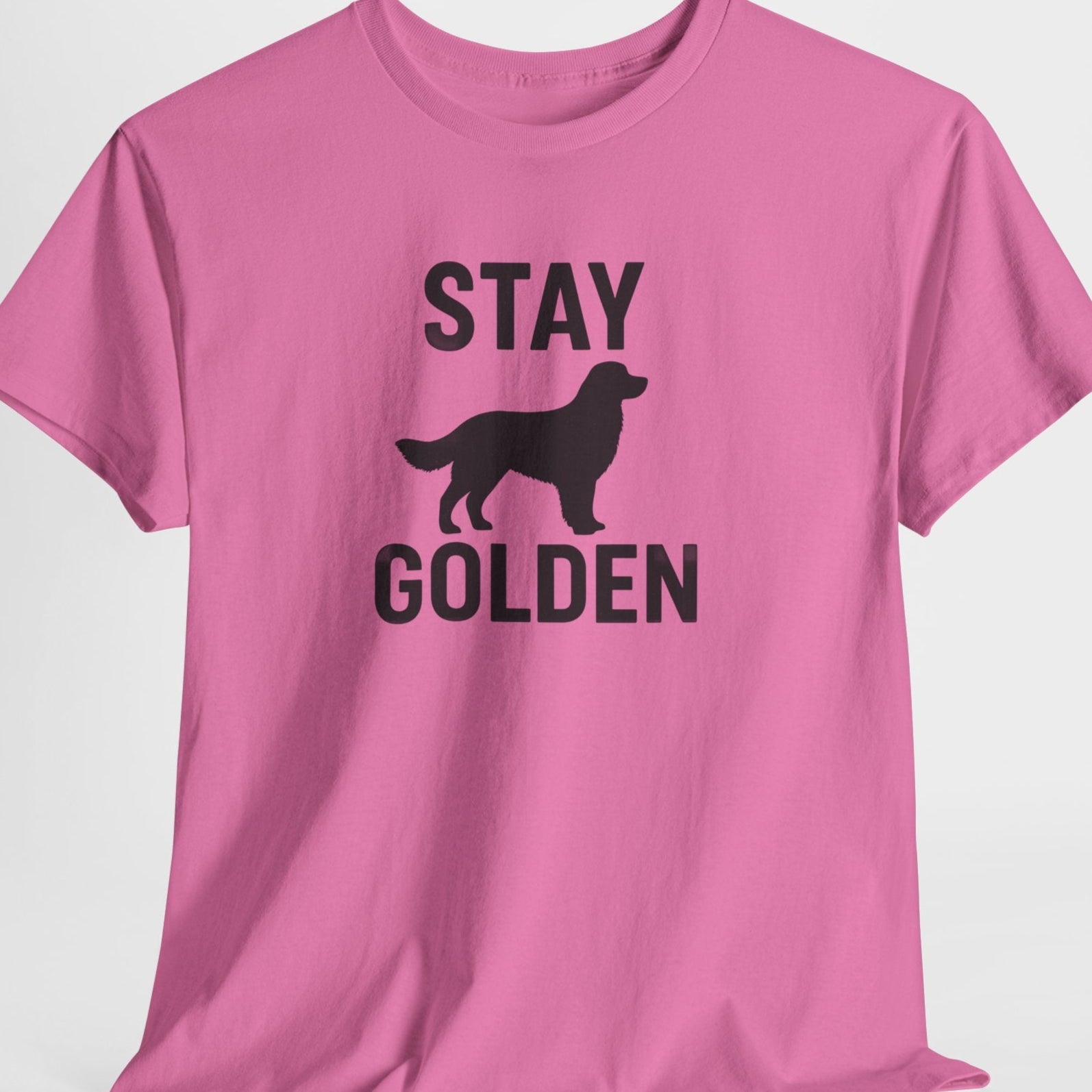 Pink t-shirt with 'Stay Golden' text and dog silhouette on a white background