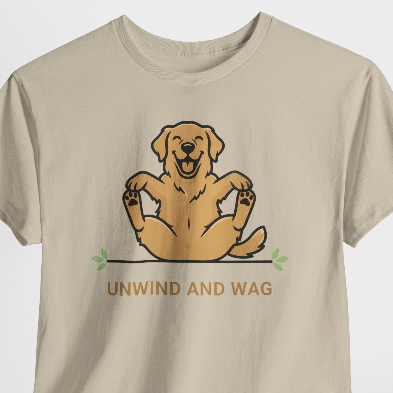 Beige t-shirt with a dog graphic and 'Unwind and Wag' text on a white background