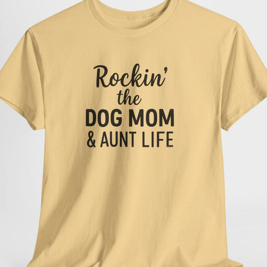 Beige t-shirt with text 'Rockin' the Dog Mom & Aunt Life' on a light gray background