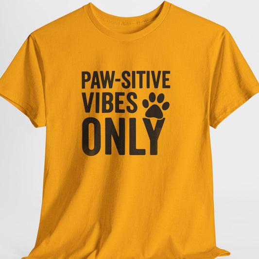 Yellow t-shirt with 'PAW-SITIVE VIBES ONLY' text on a white background