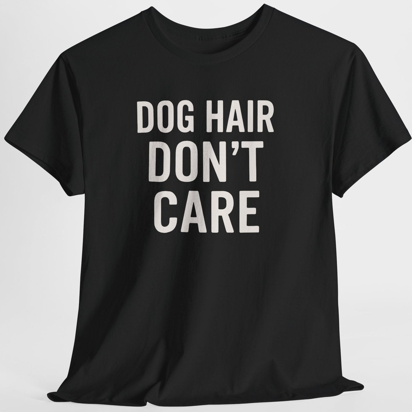 Black t-shirt with 'DOG HAIR DON'T CARE' text on a light gray background