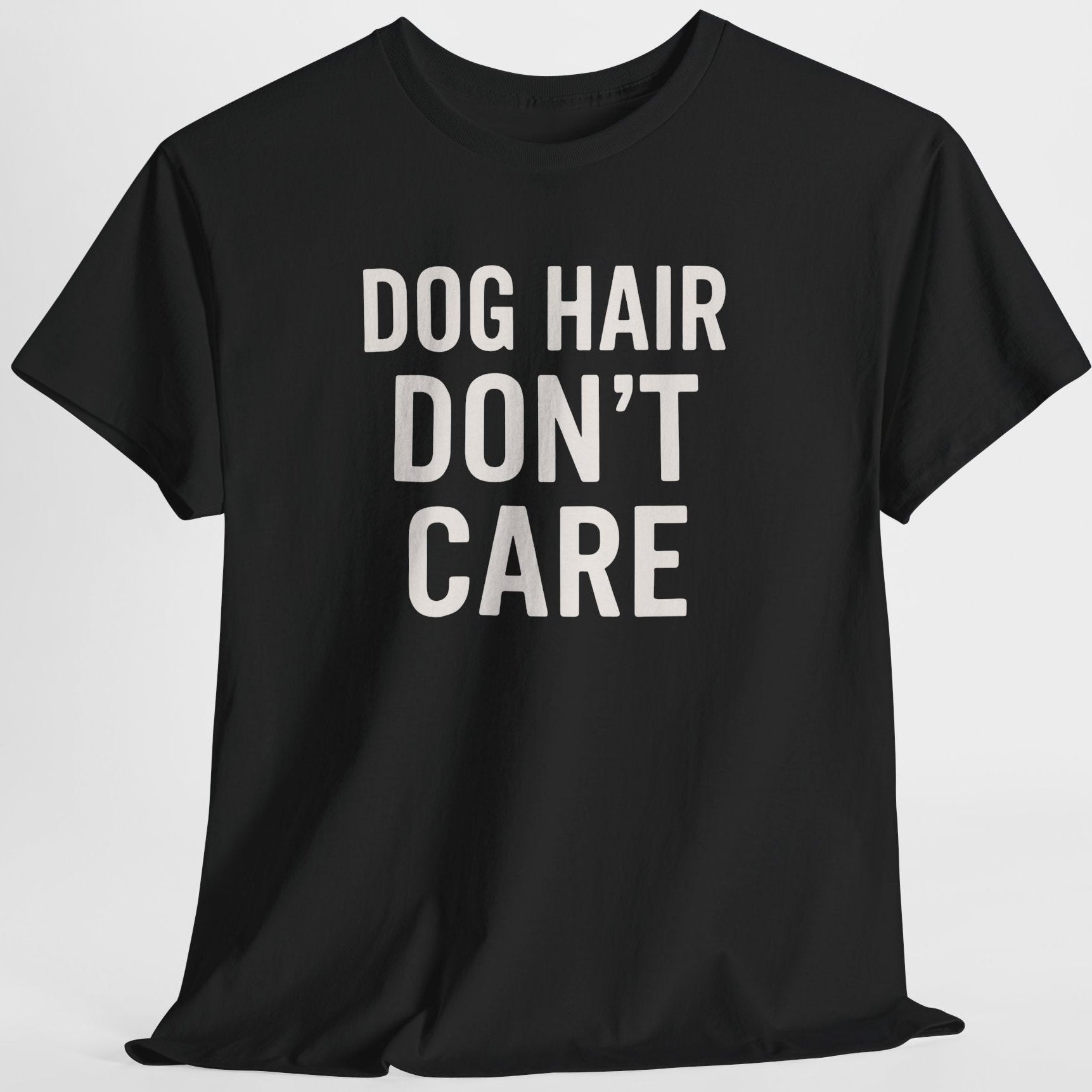 Black t-shirt with 'DOG HAIR DON'T CARE' text on a light gray background