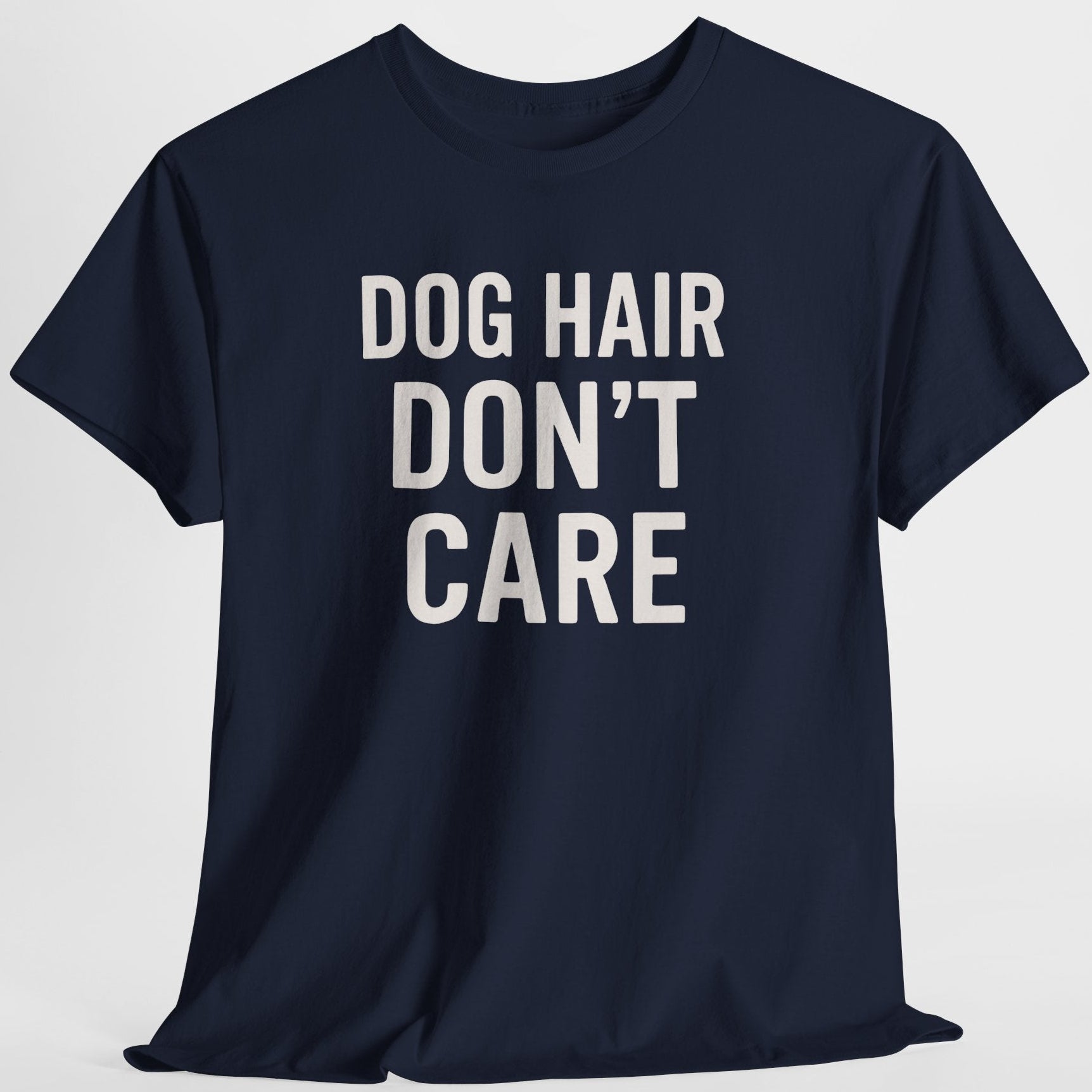 Navy blue t-shirt with 'DOG HAIR DON'T CARE' text on a light gray background