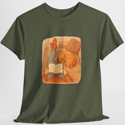Green t-shirt with a graphic of a person reading a book to a dog on a white background