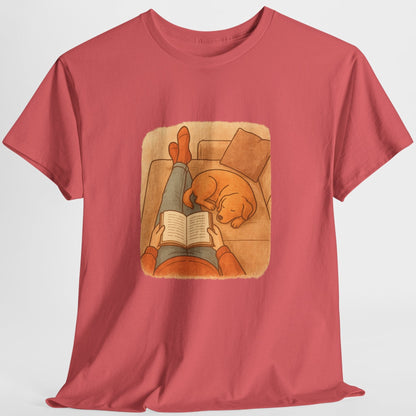 Red t-shirt with a graphic of a person reading a book to a dog on a white background