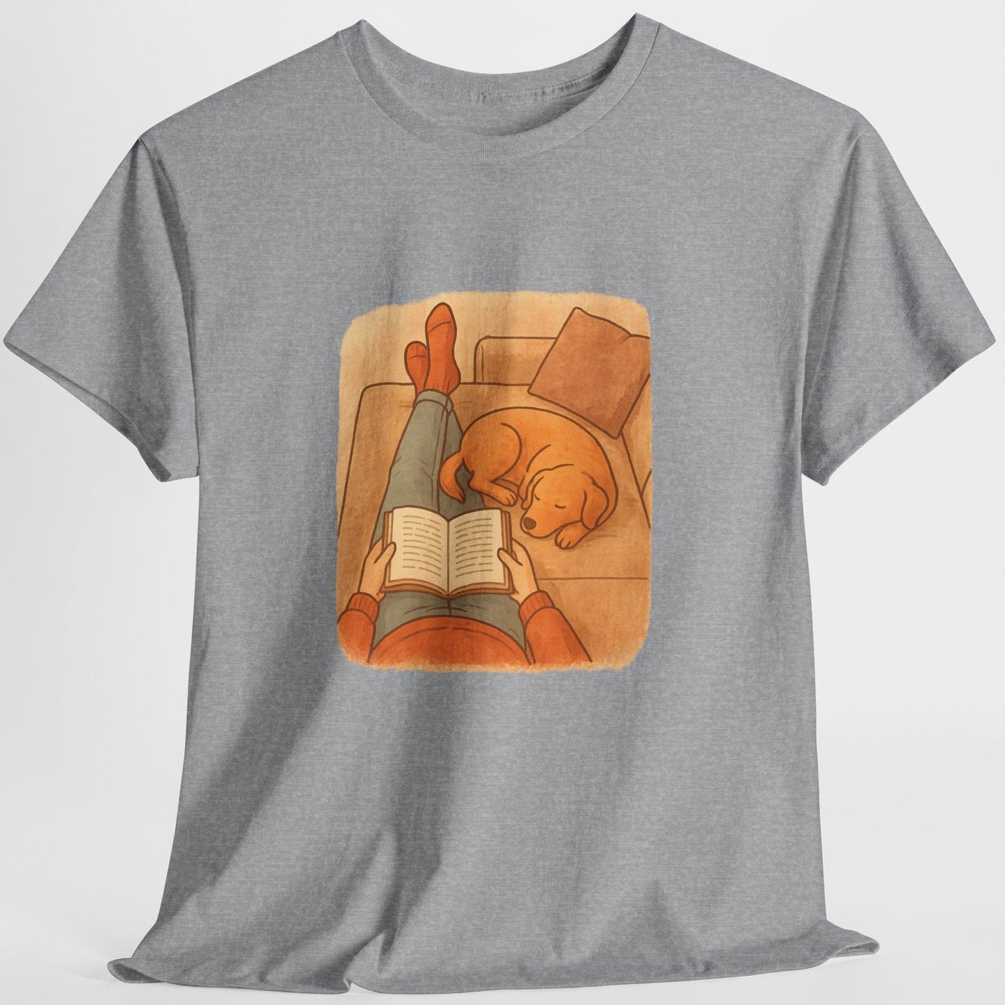 Gray t-shirt with a graphic of a person reading a book to a dog on a white background