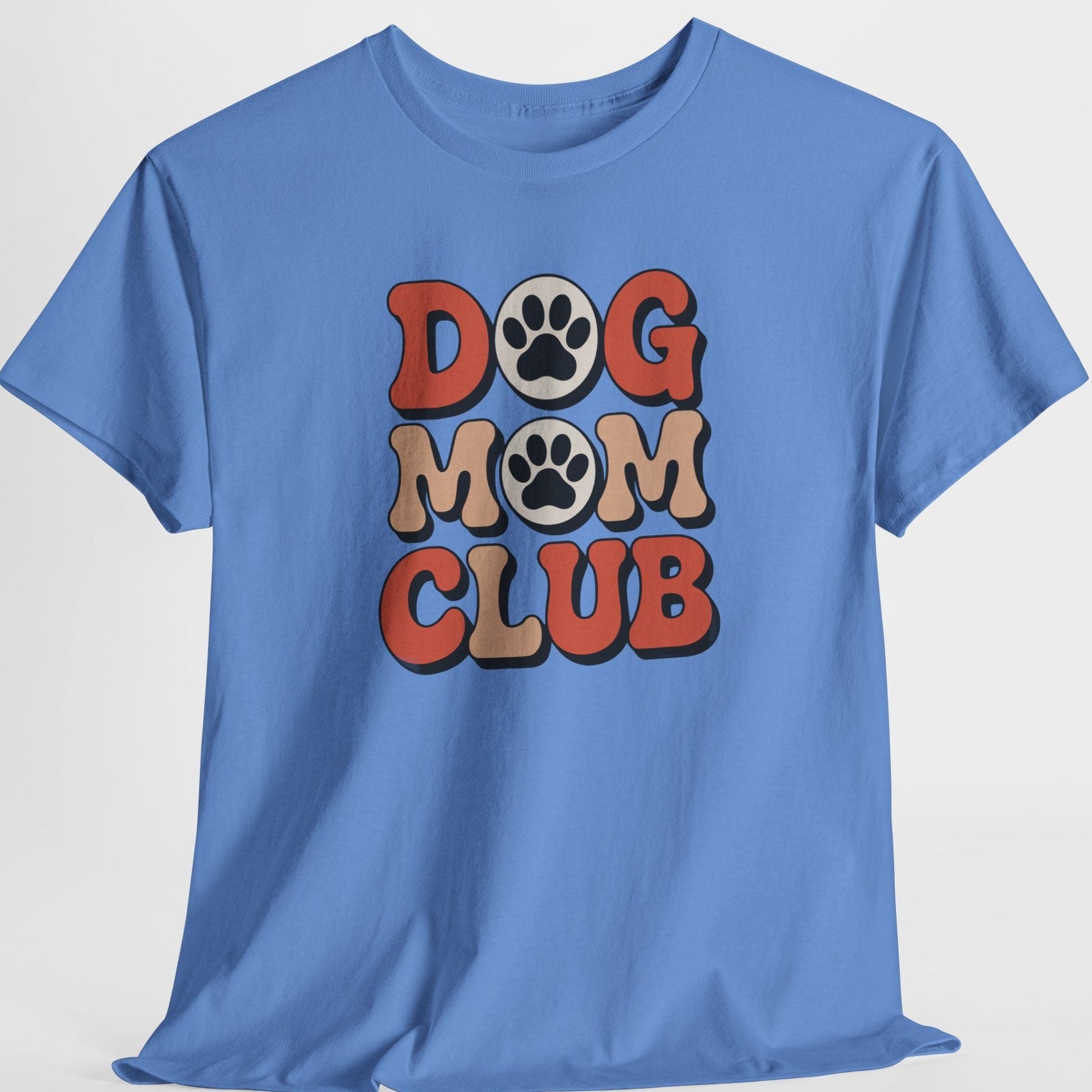 Blue t-shirt with 'DOG MOM CLUB' text and paw prints on a light gray background