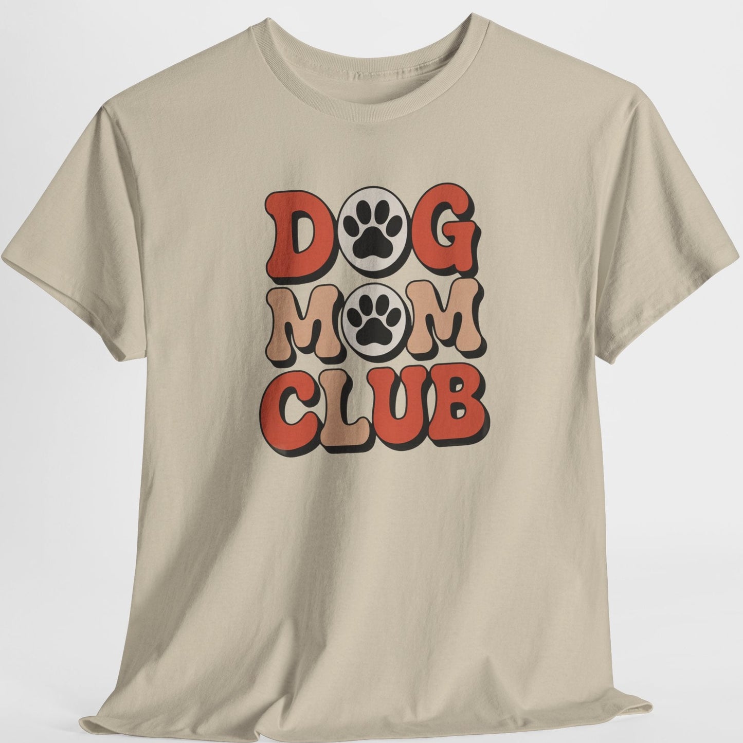 Beige t-shirt with 'Dog Mom Club' text and paw prints on a white background