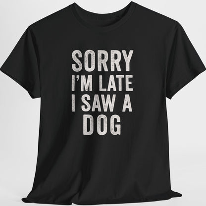 Black t-shirt with white text 'Sorry I'm late I saw a dog' on a light gray background