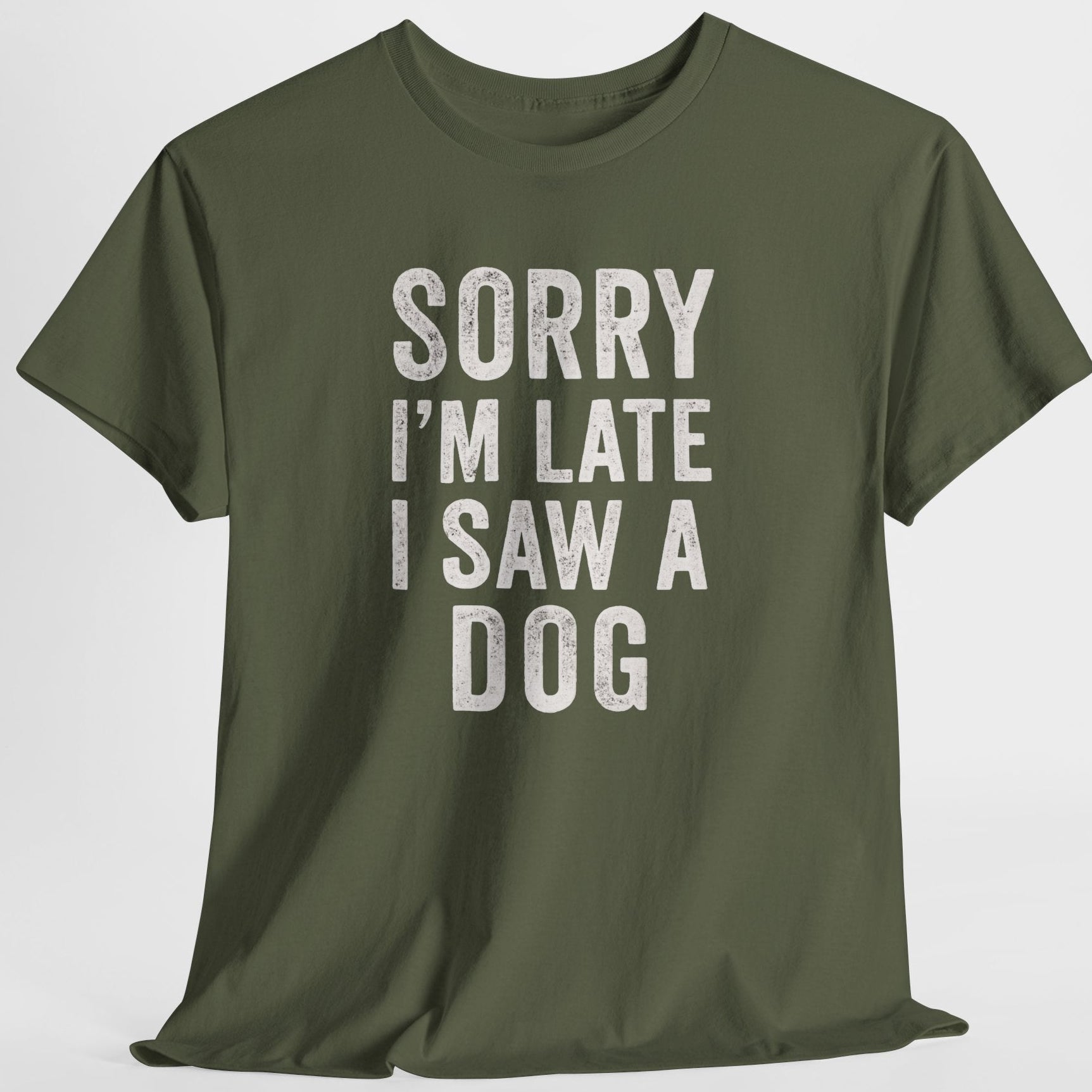 Green t-shirt with text 'Sorry I'm late I saw a dog' on a white background