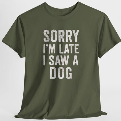 Green t-shirt with text 'Sorry I'm late I saw a dog' on a white background