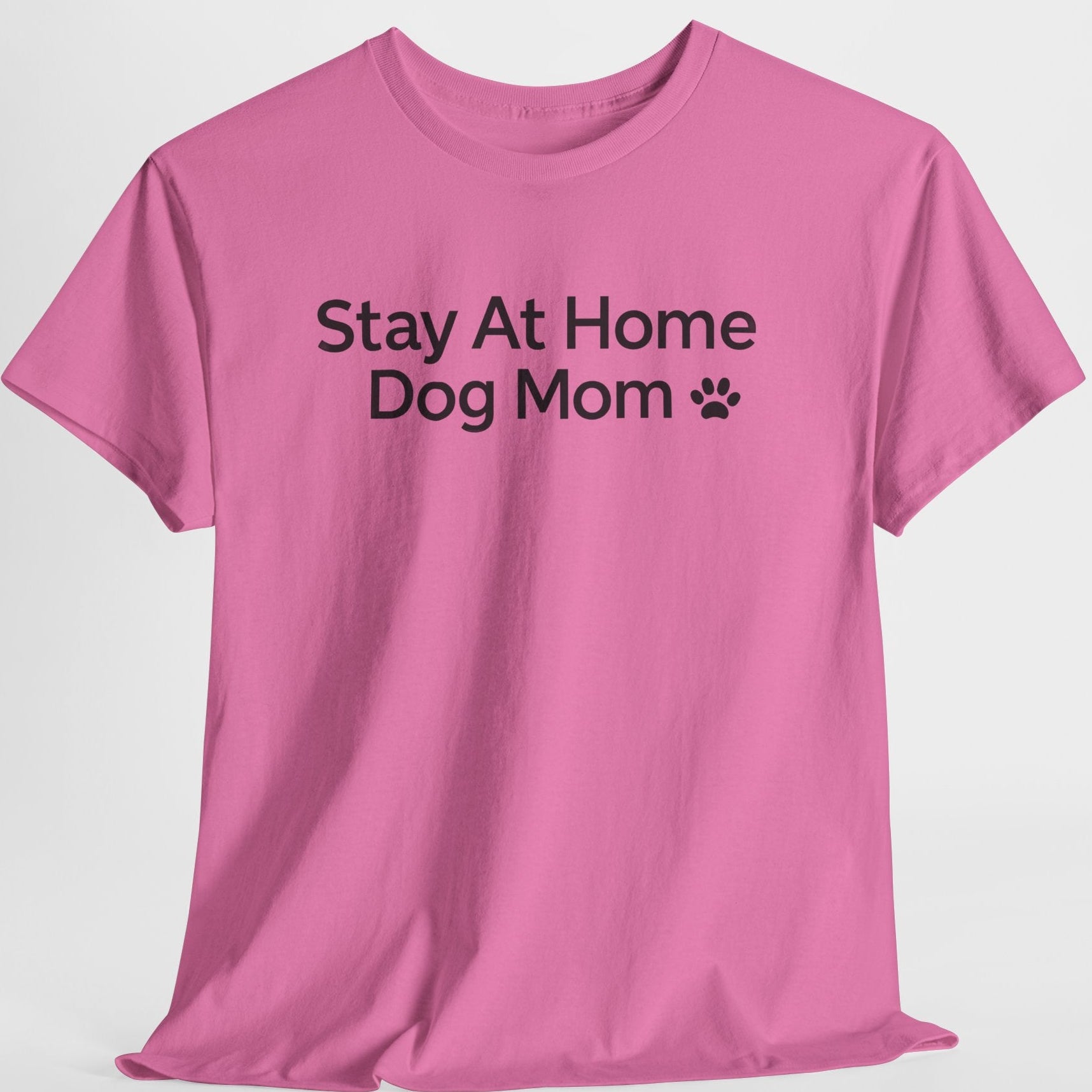 Pink t-shirt with 'Stay At Home Dog Mom' text on a white background