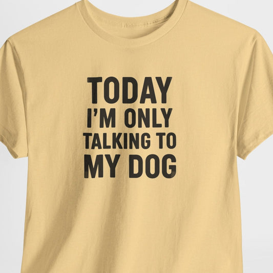 Beige t-shirt with text 'Today I'm only talking to my dog' on a light gray background